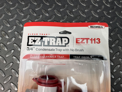 Close-up of the label on the front of a Rectorseal EZ Trap 3/4" Condensate Trap, EZT113, from Obtainium Science Surplus, highlighting the product details and branding.