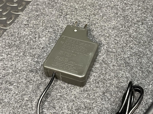 Rear view of the Fluke Temperature Probe's control unit from Obtainium Scientific Surplus, showing the power plug and attached cable on a gray textured mat.