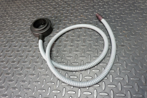 Volpi Light Ring from Obtainium Scientific Surplus. A circular light ring attached to a flexible, gray conduit, laid on a textured metallic surface.