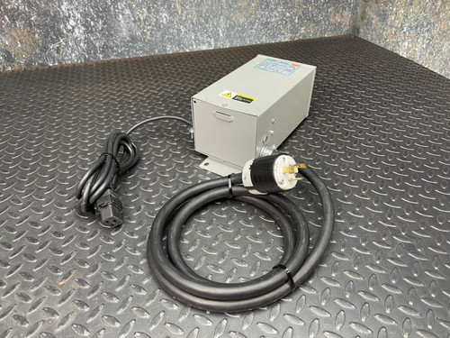 Jefferson Electric Step-Down Transformer, 216-1141-000 from Obtainium Scientific Surplus shown on a textured metal surface, with power cords attached.