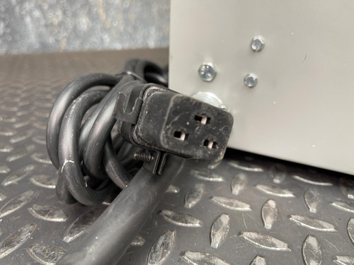 Detailed image of the power cord connector on the Jefferson Electric Step-Down Transformer, 216-1141-000 from Obtainium Scientific Surplus, showing the plug and cord end.