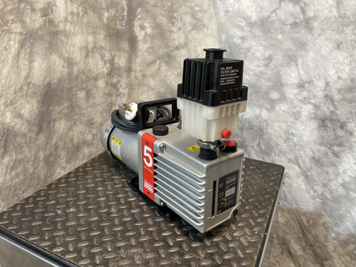 An Edwards E2M5 Two-Stage Rotary Vane Vacuum Pump for Lab or Industrial Applications from Obtainium Science and Surplus, placed on a diamond-patterned metal base.