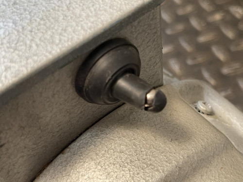 A close-up image of a small knob or valve on the Edwards E2M5 Two-Stage Rotary Vane Vacuum Pump for Lab or Industrial Applications from Obtainium Science and Surplus.