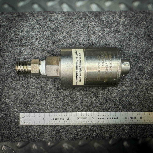 Image of an Omega pressure transducer model PX01D1, with contact information printed on it and a ruler below for scale. The device is used for measuring pressure in various applications.