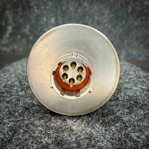 Close-up image of the connector end of an Omega pressure transducer, showing the pins for electrical connections. The connector is designed for secure and reliable attachment in pressure measurement systems. The background is a textured surface, providing contrast to the metallic finish of the connector.