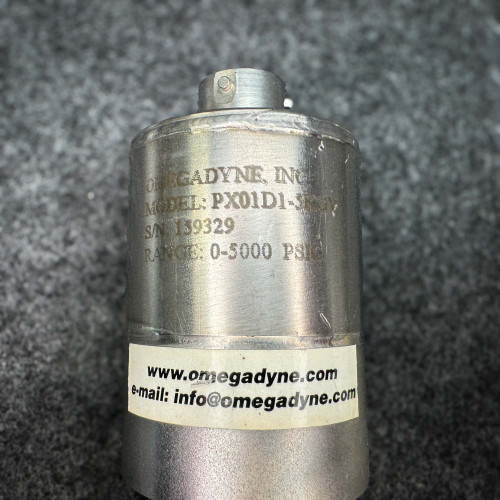 Close-up image of an Omega pressure transducer model PX01D1-5KGV, displaying its serial number 159329 and a pressure range of 0-5000 PSI. The label also includes the contact information "www.omegadyne.com" and "info@omegadyne.com." The device is designed for pressure measurement applications.