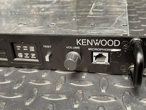 Close-up of the Kenwood Radio TKR-840-3 showing the front control panel with volume knob and microphone input.