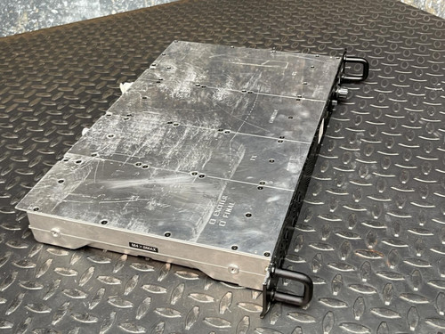 Kenwood Radio TKR-840-3 UHF HAM Radio from Obtainium Science and Surplus, top-down angled view showing the metal casing with handles on both ends, placed on a metal grid surface.