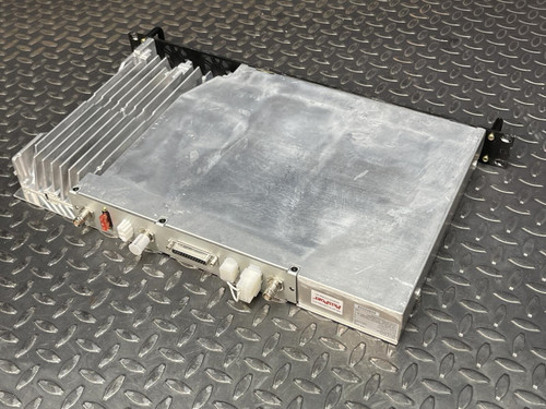 Angled rear view of the Kenwood Radio TKR-840-3 showing the finned heatsink and connection ports on a metal grid surface.