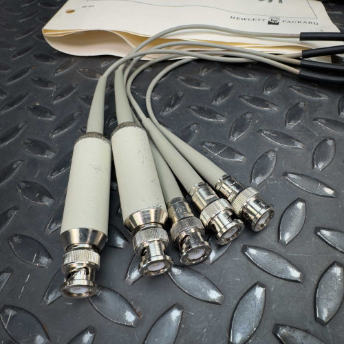 Detailed view of the cable connectors for the Hewlett Packard 16021A Test Fixture, displaying multiple connectors with metallic ends.