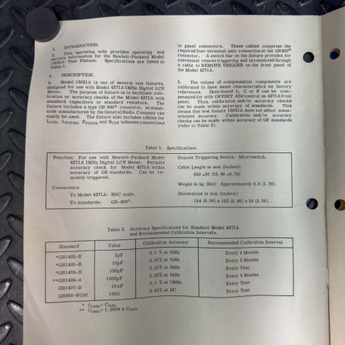 Close-up of a section of the operating manual for the Hewlett Packard 16021A Test Fixture, showing text and technical specifications.