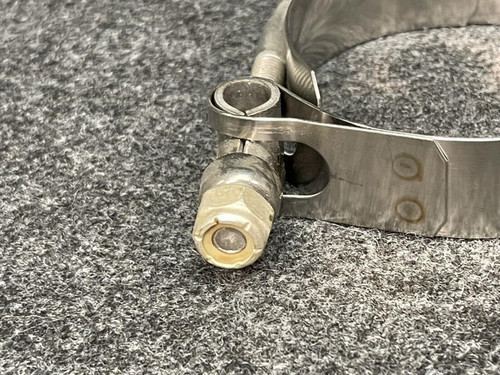 Detailed view of the tightening mechanism on a Clampco 2.5" stainless T-bolt clamp. The image focuses on the bolt and nut assembly, highlighting the precision craftsmanship of the clamp from Obtainium Science and Surplus.