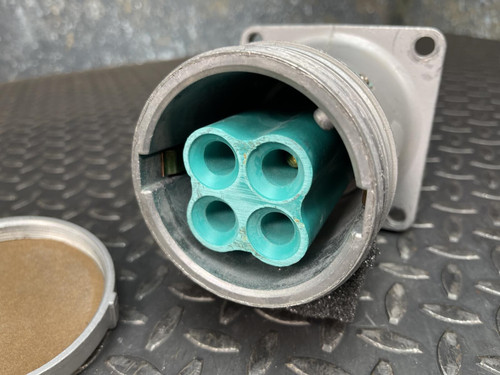 Close-up view of the Appleton Powertite ACR1034 pin and sleeve receptacle from Obtainium Science and Industry, focusing on the green socket section.