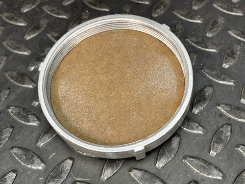 Cover of the Appleton Powertite ACR1034 pin and sleeve receptacle from Obtainium Science and Industry, placed on a textured metal surface.