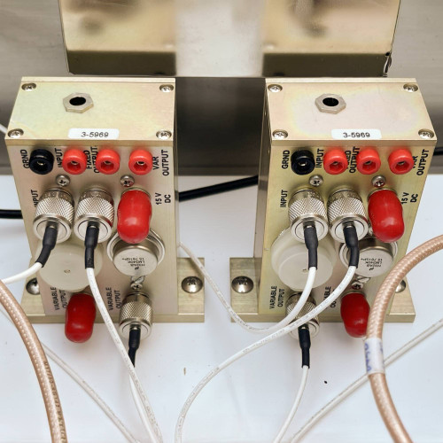 Detailed view of two connection blocks inside the TX RX Systems UHF radio frequency booster from Obtainium Science and Surplus, showing various cable connections and labeled ports.