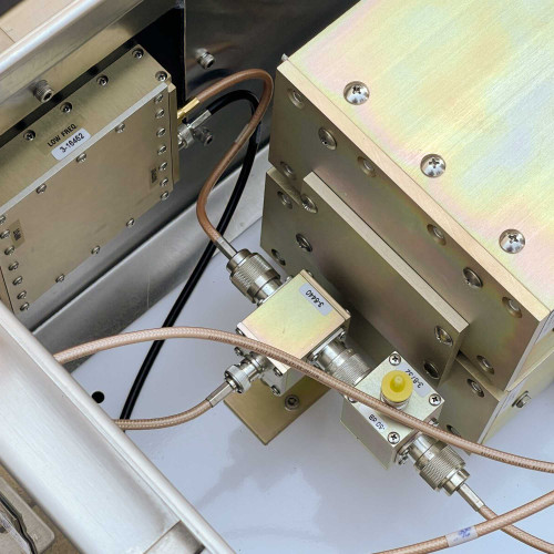 Top view inside the TX RX Systems UHF frequency booster from Obtainium Science and Surplus, showing the layout of the components and wiring.