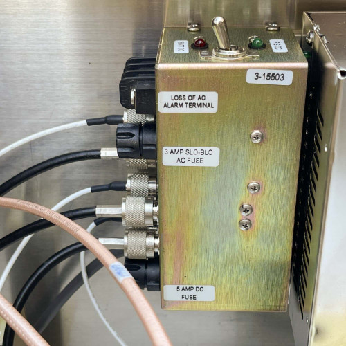 Side view of a component box with multiple cables connected, inside the TX RX Systems UHF radio frequency booster from Obtainium Science and Surplus.
