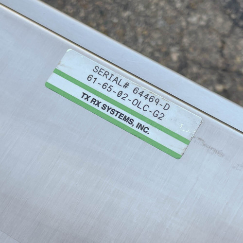 Label showing the serial number 64469-D on the exterior of the TX RX Systems UHF radio frequency booster from Obtainium Science and Surplus.