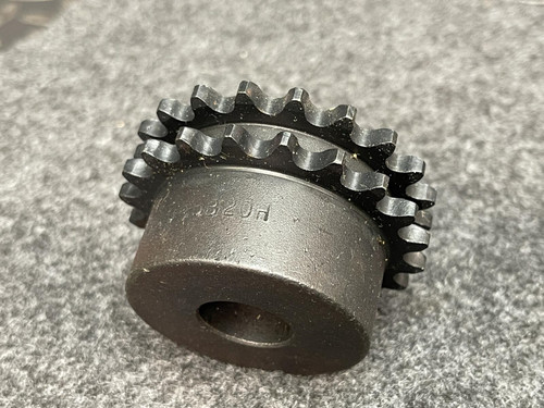 Side profile of the Martin D35B20H double-row sprocket with a clear view of the two distinct rows of sprocket teeth. Positioned on a gray surface.