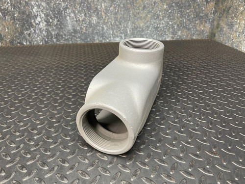 A 3-inch Appleton LL conduit body from Obtainium Science and Surplus, shown from the front, highlighting the cylindrical opening and smooth gray surface.