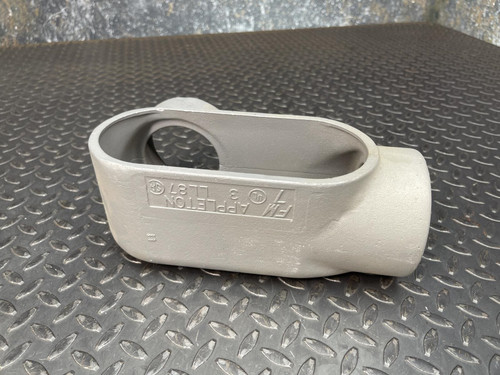 A 3-inch Appleton LL conduit body from Obtainium Science and Surplus, shown from the side with embossed text on the surface and an oval-shaped opening.