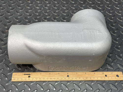 A 3-inch Appleton LL conduit body from Obtainium Science and Surplus, shown with a ruler for scale, demonstrating its size and shape.