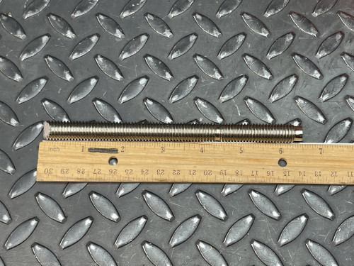 Hilti HAS-R 304 SS Anchor Rod - 1/2"x 6 1/2" from Obtainium Science and Surplus: Two threaded rods laid side by side next to a wooden ruler, showing their length on a textured metal surface.