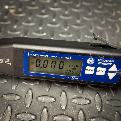 Detailed close-up of the digital display on the Sturtevant Richmont Exacta 2 torque wrench. The screen shows a reading of "0.000" and units in both ft.lb and Nm, with options for target, residual, peak, and stored settings, highlighting the precision and versatility of the tool.