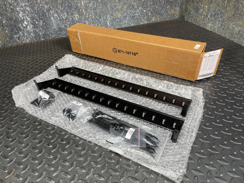 APC Basic PDU Accessory Kit from Obtainium Science and Surplus, featuring various components including black metal mounting brackets and cables, displayed on a gray metal surface.