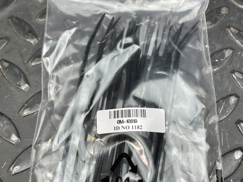 A plastic bag containing multiple black zip ties, labeled with a barcode, part of the APC Basic PDU Accessory Kit from Obtainium Science and Surplus.