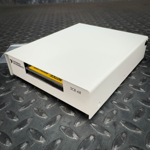 The image shows a National Instruments SCB-68 terminal block connector, available from Obtainium Science & Industry Surplus. The device is rectangular and primarily white, sitting on a textured metal surface, with the model number "SCB-68" visible on the side.