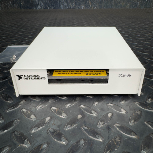 The image displays a National Instruments SCB-68 terminal block connector from Obtainium Science & Industry Surplus. The white rectangular device is placed on a textured metal surface, with the National Instruments logo and model number "SCB-68" clearly visible on the front.