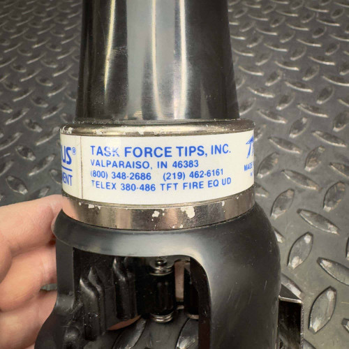 Detail of Task Force Tips TFT LX FoamJet firefighter foam-making attachment from Obtainium Science & Industry Surplus, with a clear view of the company information on the label.
