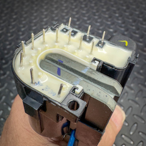 Another angle of a vintage CRT monitor flyback transformer from Obtainium Science & Industry Surplus, showcasing the pin connectors and internal structures.