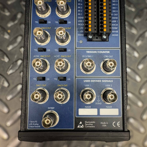 Detailed view of the lower section of the National Instruments BNC-2110 terminal block from Obtainium Science and Surplus, showing connectors and labeling.