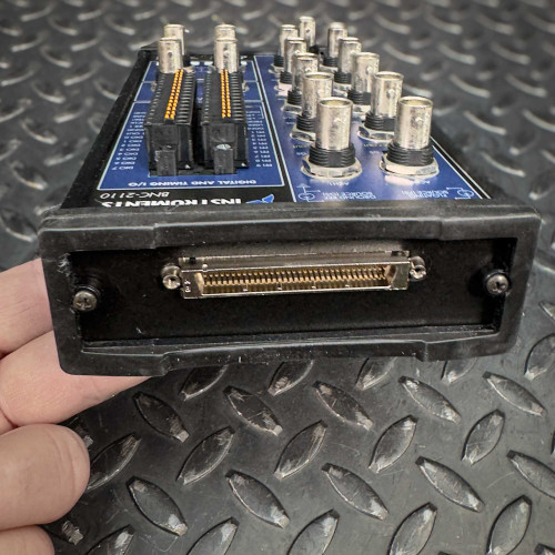 Side view of the National Instruments BNC-2110 terminal block from Obtainium Science and Surplus, displaying the connection port.