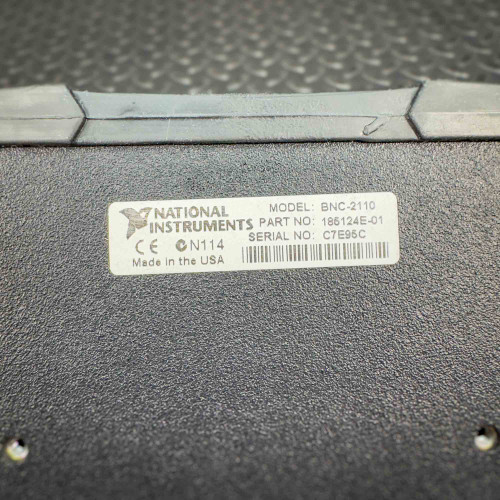 Label on the back of the National Instruments BNC-2110 terminal block from Obtainium Science and Surplus, indicating the model, part number, and serial number.