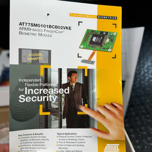A close-up of the front page of the ATMEL Biometric FingerChip module leaflet from the Obtainium Science Surplus Store, showcasing a man using a biometric device for increased security.