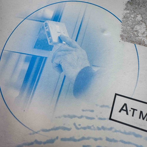 Image of a hand holding a device up to a reader, part of the ATMEL Biometric FingerChip development board kit from the Obtainium Science Surplus Store.