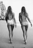 Fashion shoot with swimsuit models walking on the beach