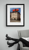 Elvis Costello, This Year\'s Model Billboard Photo by Robert Landau framed by arm chair.