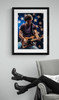 Bruce Springsteen #2 | Classic Rock Photo | Limited Edition Print framed in black by an armchair by Jeffrey Mayer. Bruce is performing in front of a patriotic star filled back drop.