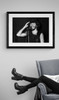 Bruce Springsteen #7 by Richard E. Aaron | Framed in black and displayed by a reading chair. | Bruce Springsteen wearing a cool black hat with a big smile.