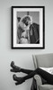 The Who #1 | Roger Daltrey rocking out on his harmonica. Classic Rock Photo framed in black | Limited Edition Print by Jeffrey Mayer displayed by arm chair