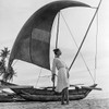 Ceylon Sails by Gleb Derujinsky | Vintage Fashion Photo | Fashion shot of a woman on the beach near a Sailboat