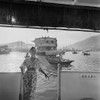 Hong Kong Harbor Photo by Gleb Derujinsky. Model on the back of a large boat