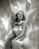 Stunning shot of Marlene Dietrich with white feathers by George Hurrell.