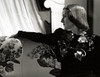Norma Shearer in profile in an embellished black gown by Laszlo Willinger.