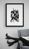 KISS #2 by Richard E. Aaron | Band Portrait shot (Paul Stanley, Gene Simmons, Ace Frehley and Peter Criss) | Framed in black and displayed near an arm chair