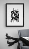 KISS #2 by Richard E. Aaron | Band Portrait shot (Paul Stanley, Gene Simmons, Ace Frehley and Peter Criss) | Framed in black and displayed near an arm chair